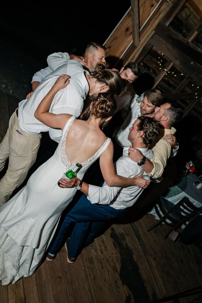 Wedding guests celebrating on the dance floor at The Homestead Farm Historic Wright-Barton Venue